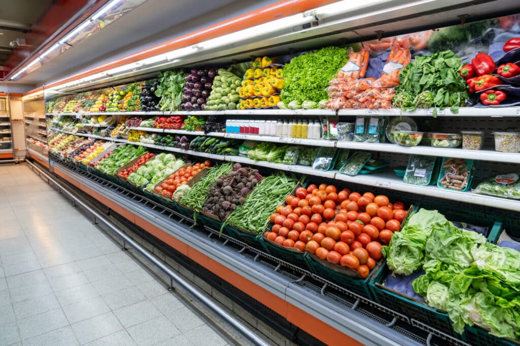 Fresh vegetables in the refrigerated section of the supermarket